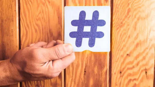 Person holding the hashtag symbol between his fi 2026 03 10 04 47 00 utc Person holding the hashtag symbol between his fi 2026 03 10 04 47 00 utc